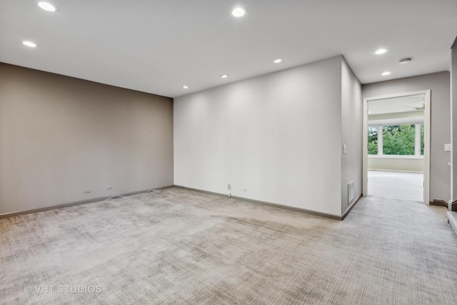 spare room with light colored carpet