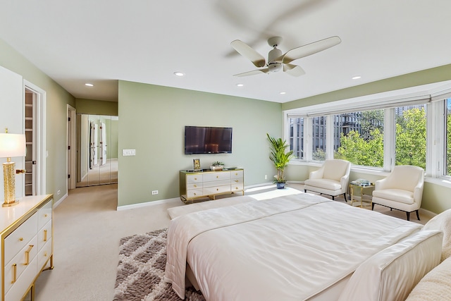 bedroom with light colored carpet and ceiling fan