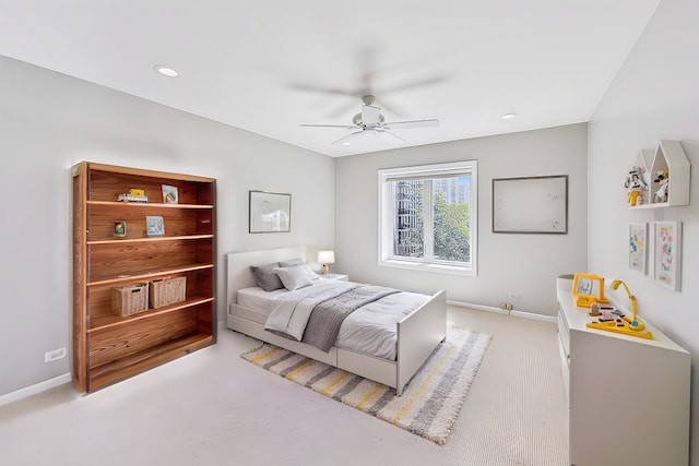 bedroom featuring ceiling fan and light carpet