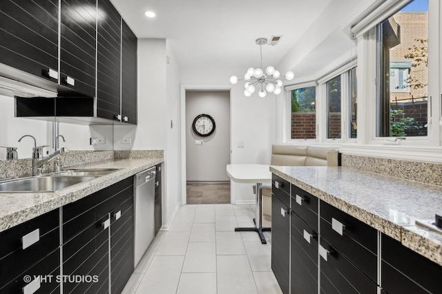 kitchen featuring light tile patterned floors, sink, an inviting chandelier, hanging light fixtures, and stainless steel dishwasher