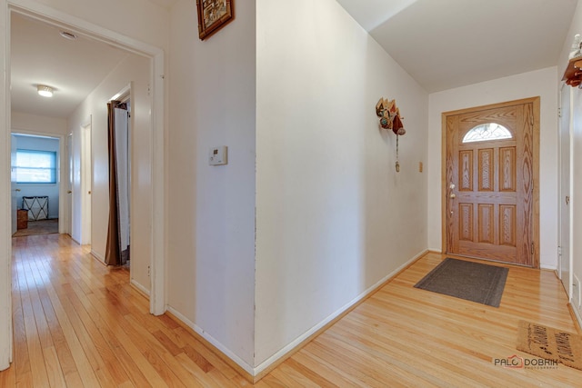 entryway with light hardwood / wood-style floors