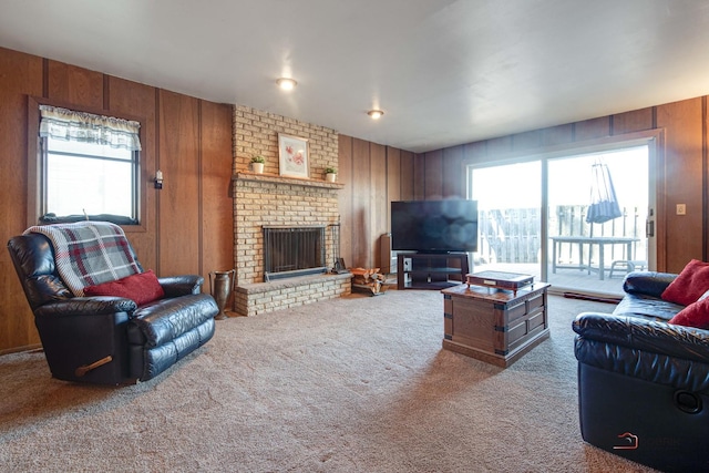 living room featuring carpet, a fireplace, and wooden walls