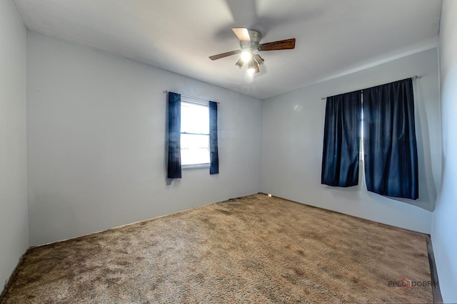 empty room with carpet and ceiling fan