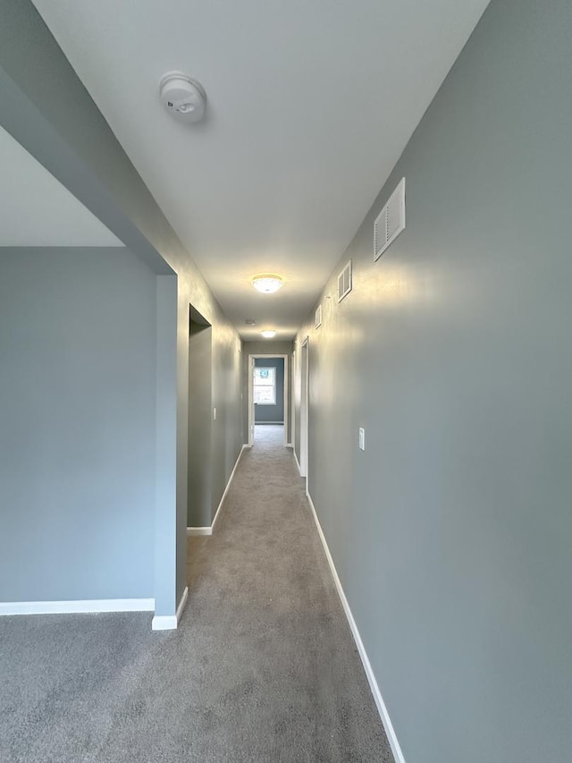 corridor with light colored carpet