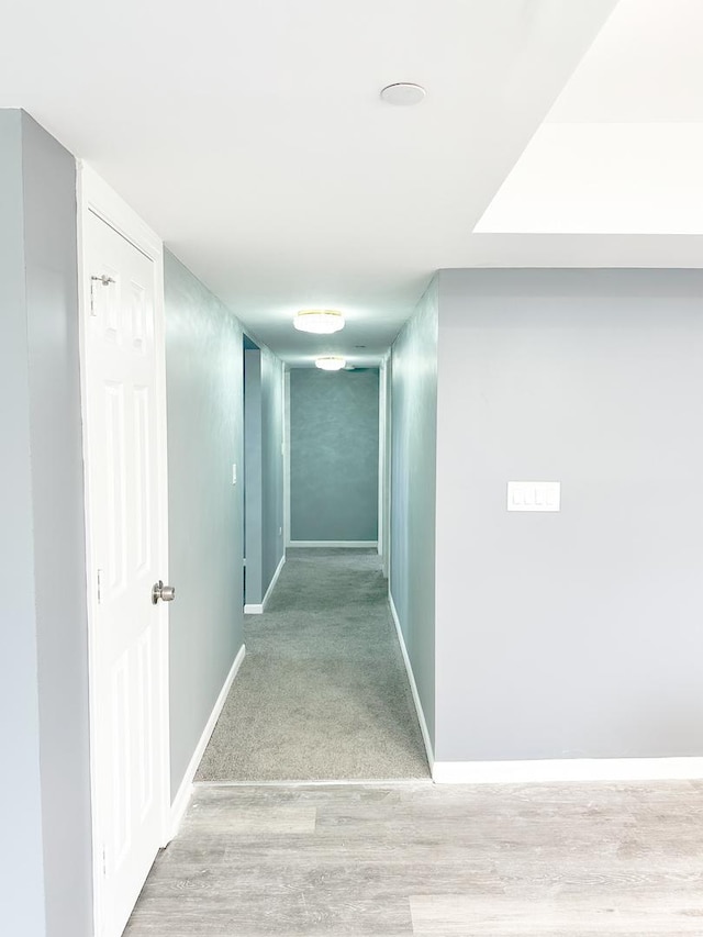 corridor featuring light hardwood / wood-style floors