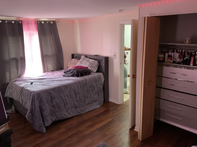 bedroom featuring dark hardwood / wood-style flooring