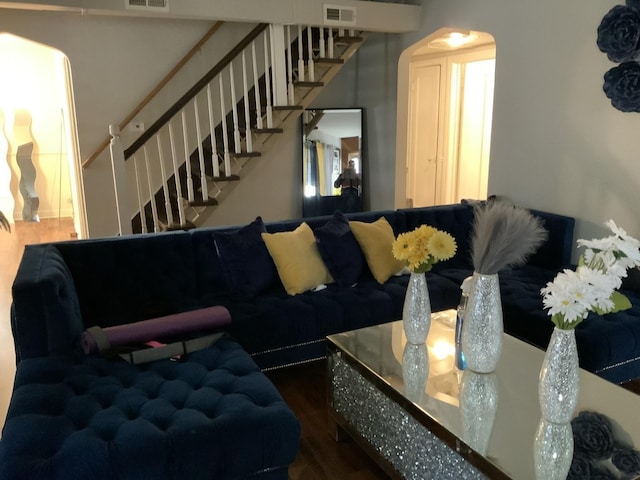 15821 Whipple Ave, Markham, IL 60428 - living area featuring arched walkways, stairs, and wood finished floors