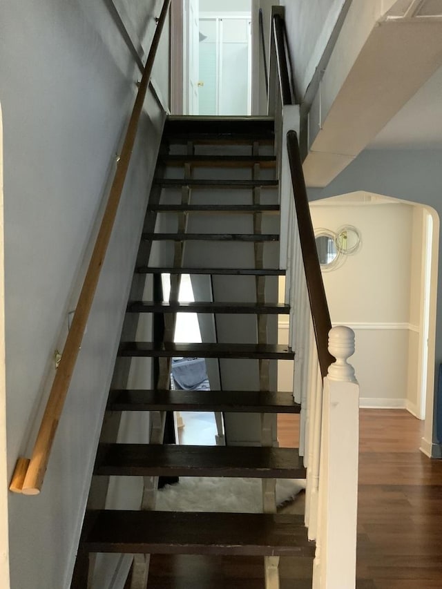 stairway with wood-type flooring