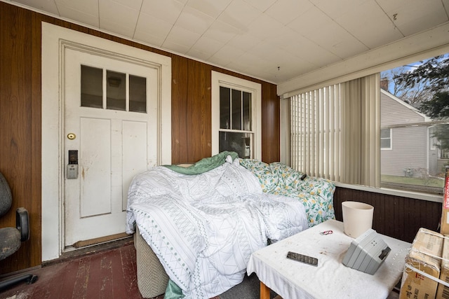 bedroom with wooden walls