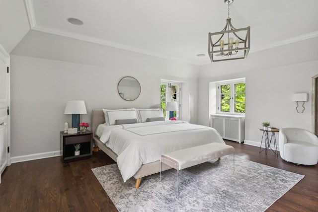 bedroom featuring dark hardwood / wood-style floors, ornamental molding, radiator, and a chandelier