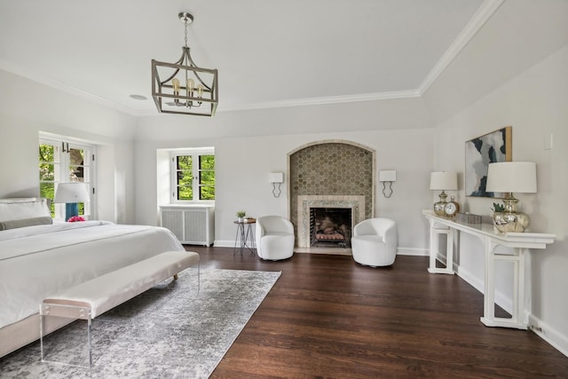 bedroom featuring dark hardwood / wood-style flooring, ornamental molding, radiator, and a chandelier