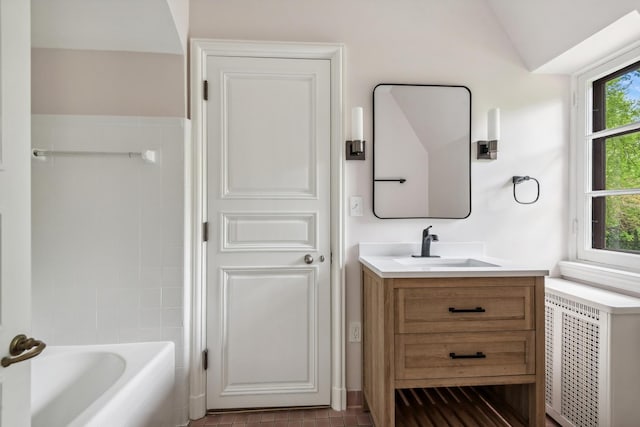 bathroom with vanity and vaulted ceiling