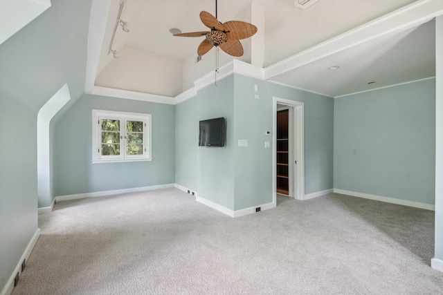 spare room featuring light colored carpet, high vaulted ceiling, and ceiling fan