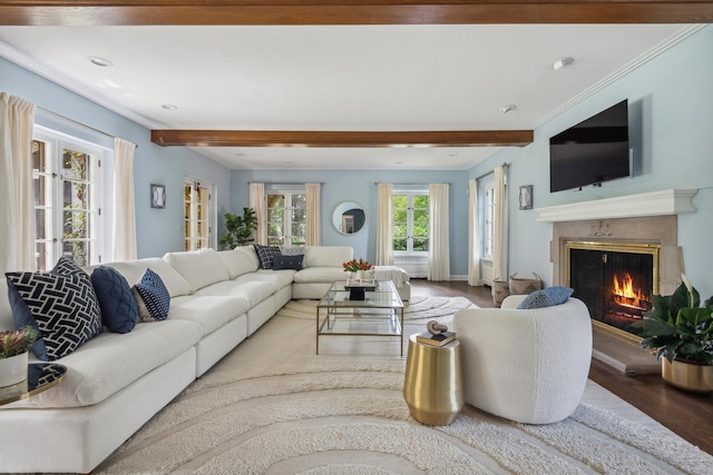 living room featuring beam ceiling, a high end fireplace, and hardwood / wood-style flooring