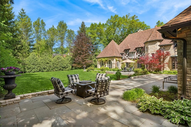 view of patio with a fire pit