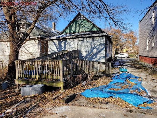 view of home's exterior with a wooden deck