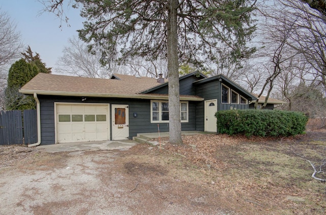 ranch-style house featuring a garage