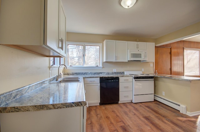 kitchen with white cabinets, white appliances, baseboard heating, and sink