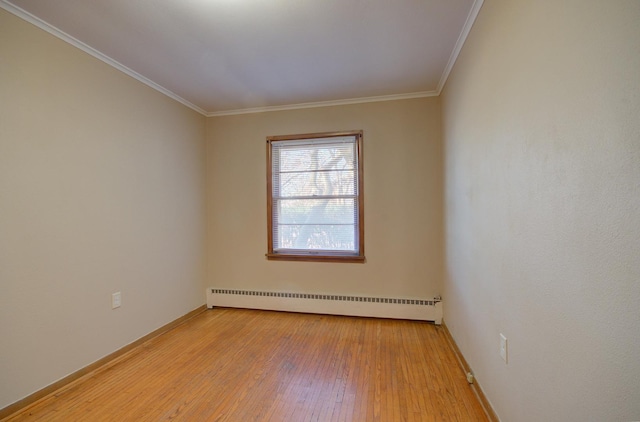 unfurnished room with ornamental molding, light hardwood / wood-style flooring, and a baseboard heating unit