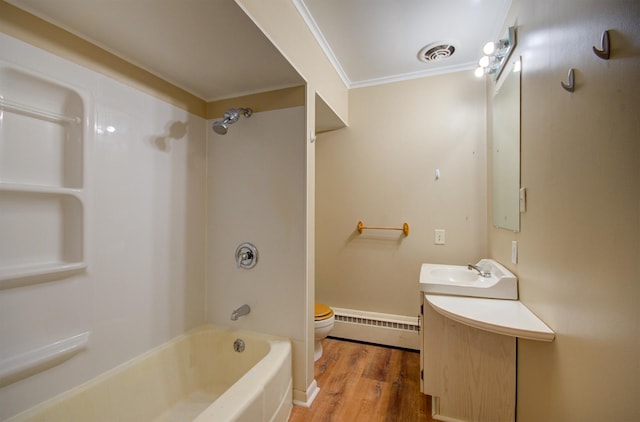 full bathroom featuring vanity, baseboard heating, crown molding, hardwood / wood-style flooring, and toilet