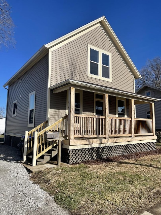 rear view of house with a porch