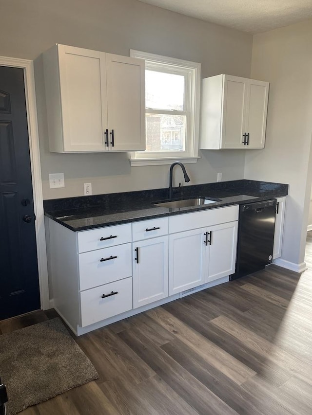 kitchen with white cabinetry, sink, and black dishwasher