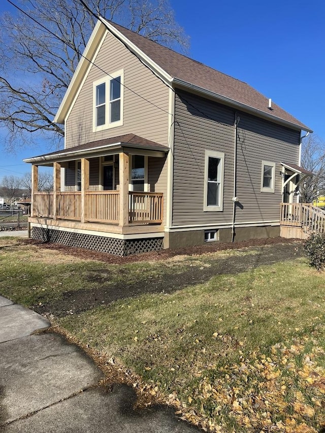 exterior space with a porch and a yard