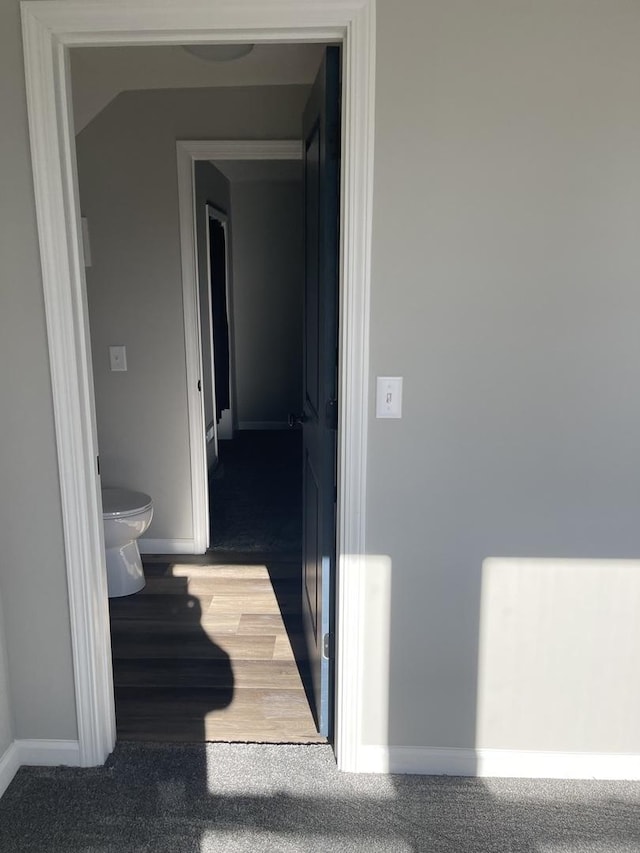 corridor featuring hardwood / wood-style flooring