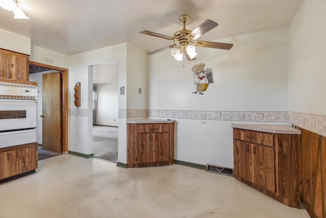 kitchen with oven and ceiling fan