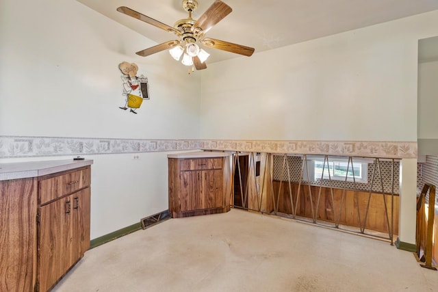 interior space featuring ceiling fan