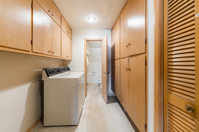 laundry area with cabinets