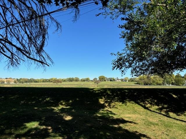 view of yard with a rural view