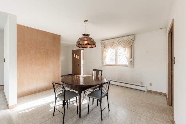 dining area featuring a baseboard heating unit