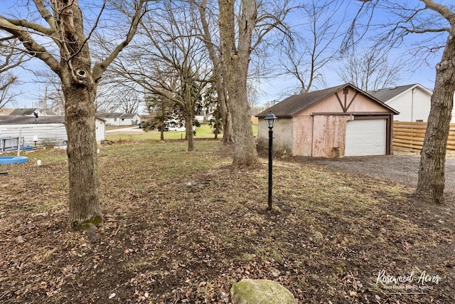 view of yard with an outbuilding and a garage