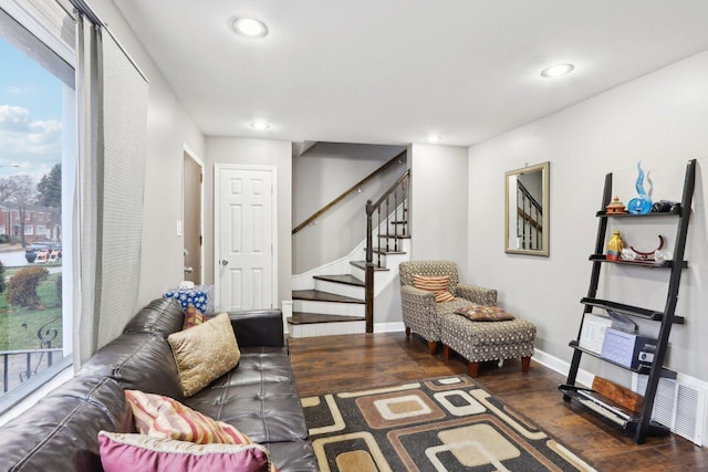 living room with dark hardwood / wood-style floors