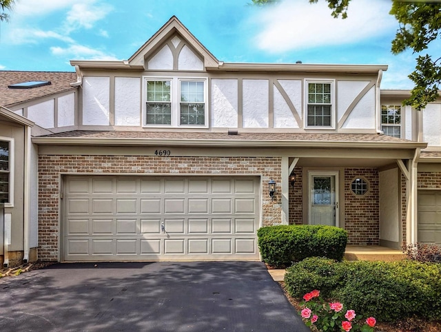 tudor-style house with a garage