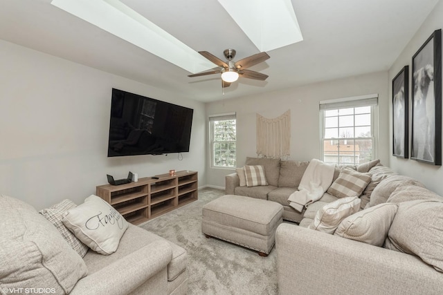 carpeted living room featuring ceiling fan