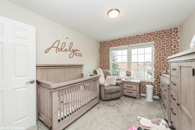 carpeted bedroom featuring a crib