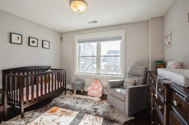 bedroom featuring a crib