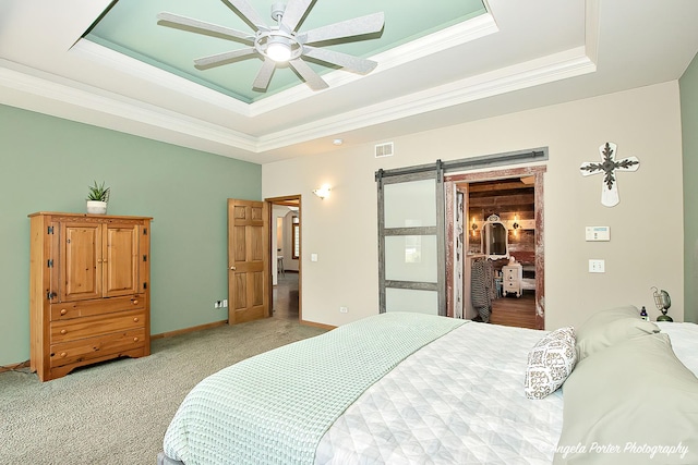 35161 N Indian Trl, Ingleside, IL 60041 - bedroom featuring visible vents, a barn door, ornamental molding, a spacious closet, and a raised ceiling