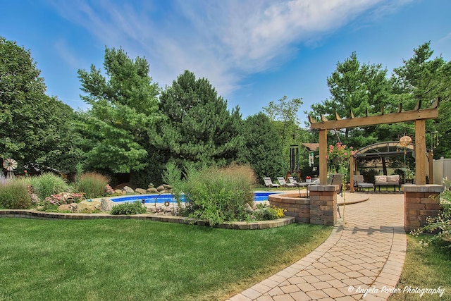 35161 N Indian Trl, Ingleside, IL 60041 - view of yard featuring an outdoor pool, a pergola, and a patio