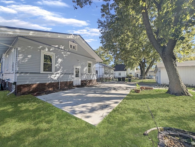 view of property exterior featuring a lawn