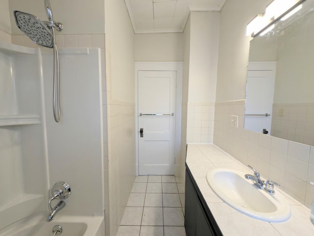 bathroom with tile patterned flooring, vanity, shower / bath combination, and crown molding