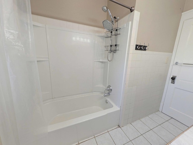 bathroom featuring tile patterned floors, shower / bath combo with shower curtain, and tile walls