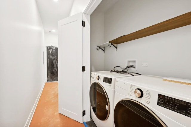 washroom featuring washer and dryer