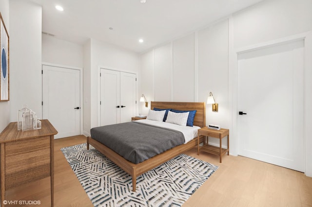 bedroom featuring light hardwood / wood-style floors and a closet