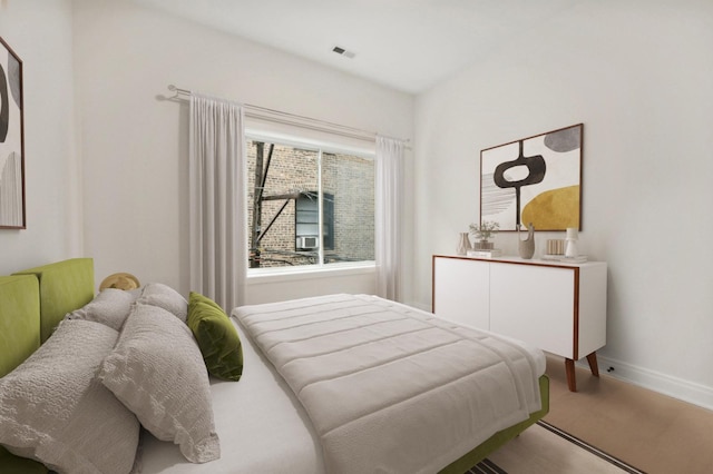 bedroom with hardwood / wood-style floors