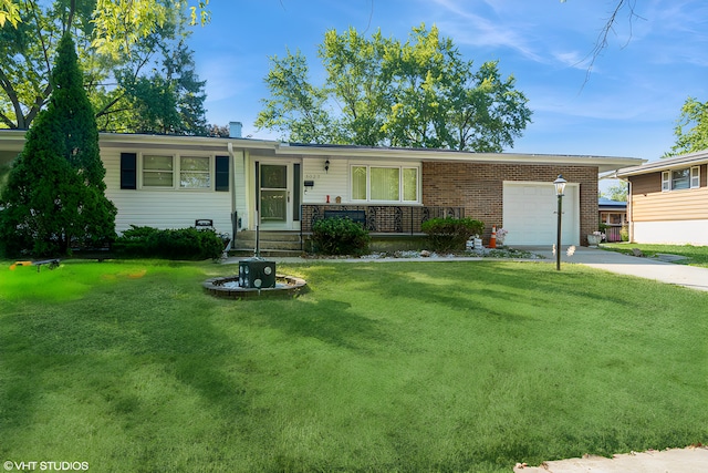 single story home featuring a garage and a front lawn