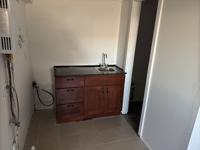 bathroom featuring tile patterned flooring and vanity