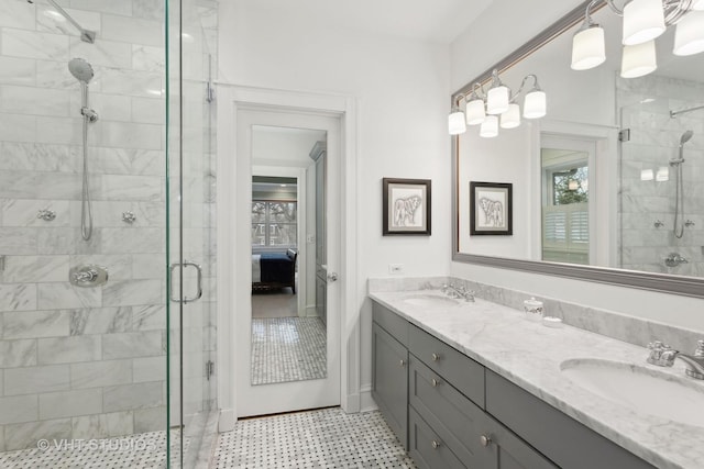 bathroom featuring vanity and an enclosed shower